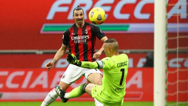 MILAN, ITALY - FEBRUARY 07: Zlatan Ibrahimovic of AC Milan scores their side's first goal past Alex Cordaz of Crotone during the Serie A match between AC Milan and FC Crotone at Stadio Giuseppe Meazza on February 07, 2021 in Milan, Italy. Sporting stadiums around Italy remain under strict restrictions due to the Coronavirus Pandemic as Government social distancing laws prohibit fans inside venues resulting in games being played behind closed doors. (Photo by Marco Luzzani/Getty Images)