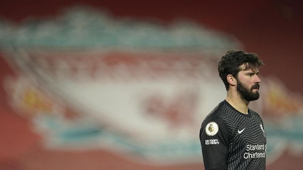 Liverpool's goalkeeper Alisson stands on the pitch during the English Premier League soccer match between Liverpool and Manchester City at Anfield Stadium, Liverpool, England, Sunday, Feb. 7, 2021. (AP photo/Jon Super, Pool)