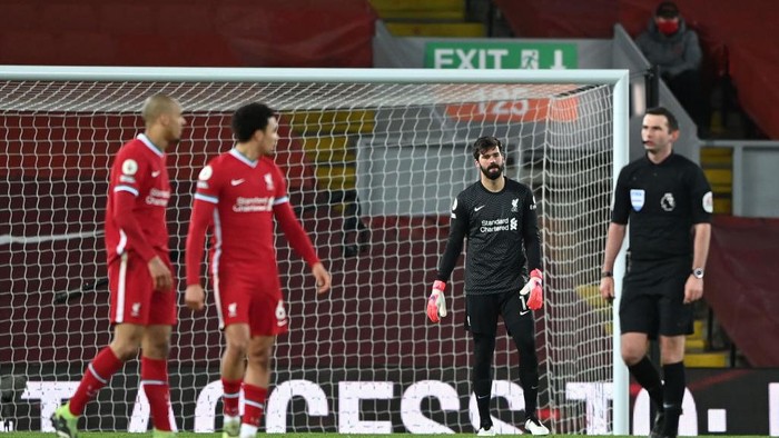 LIVERPOOL, ENGLAND - FEBRUARY 07: Alisson Becker of Liverpool looks dejected after Liverpools third goal scored by Raheem Sterling (Not pictured) of Manchester City during the Premier League match between Liverpool and Manchester City at Anfield on February 07, 2021 in Liverpool, England. Sporting stadiums around the UK remain under strict restrictions due to the Coronavirus Pandemic as Government social distancing laws prohibit fans inside venues resulting in games being played behind closed doors. (Photo by Laurence Griffiths/Getty Images)