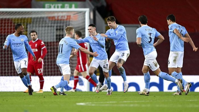 Manchester City Manchester Citys Phil Foden, center, celebrates after scoring his sides fourth goal during the English Premier League soccer match between Liverpool and Manchester City at Anfield Stadium, Liverpool, England, Sunday, Feb. 7, 2021. (Laurence Griffiths/Pool via AP)