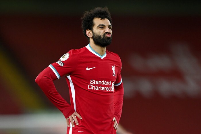 Liverpools Mohamed Salah reacts after Manchester Citys Phil Foden scored his sides fourth goal during the English Premier League soccer match between Liverpool and Manchester City at Anfield Stadium, Liverpool, England, Sunday, Feb. 7, 2021. (Laurence Griffiths/Pool via AP)