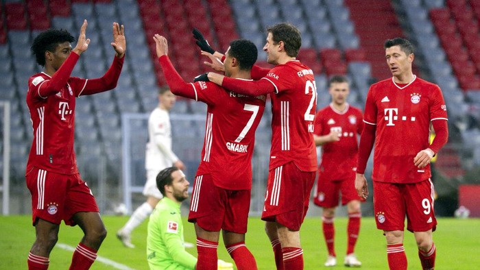 From left, Bayerns Kingsley Coman, Serge Gnabry, Thomas Mller, Joshua Kimmich and Robert Lewandowski celebrate after their fourth goal during the German Bundesliga soccer match between Bayern Munich and TSG 1899 Hoffenheim at the Allianz Arena in Munich, Germany, Saturday, Jan. 30, 2021. (Sven Hoppe/Pool Photo via AP)