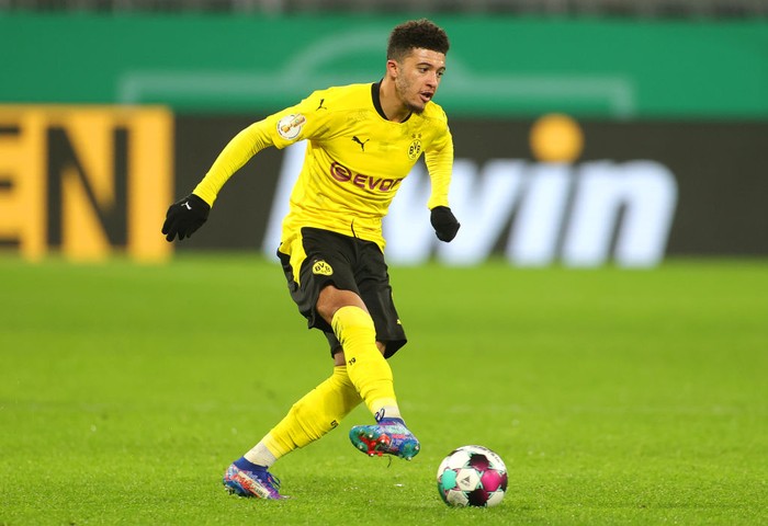 Jadon Sancho DORTMUND, GERMANY - FEBRUARY 02: Jadon Sancho of Borussia Dortmund reacts during the DFB Cup Round of Sixteen match between Borussia Dortmund and SC Paderborn 07 at Signal Iduna Park on February 02, 2021 in Dortmund, Germany. Sporting stadiums around Germany remain under strict restrictions due to the Coronavirus Pandemic as Government social distancing laws prohibit fans inside venues resulting in games being played behind closed doors. (Photo by Friedemann Vogel - Pool/Getty Images)