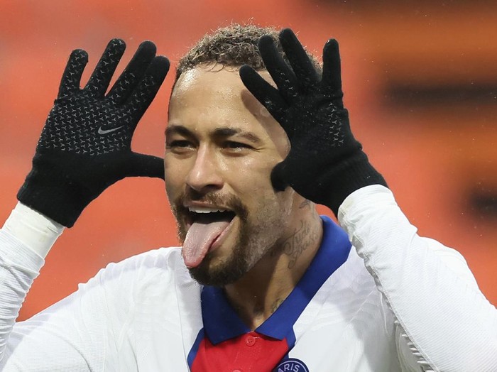 PSG's Neymar celebrates after scoring his side's second goal during the French League One soccer match between FC Lorient and Paris Saint-Germain at the Moustoir stadium in Lorient, western France, Sunday, Jan. 31, 2021. (AP Photo/David Vincent)