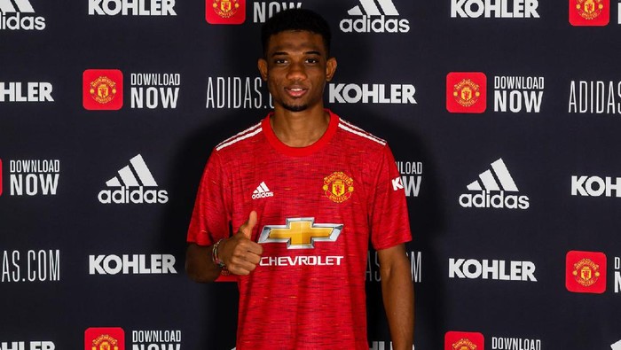 MANCHESTER, ENGLAND - JANUARY 13:  Amad Diallo of Manchester United poses with his team shirt on his first day at Aon Training Complex on January 13, 2021 in Manchester, England. (Photo by Ash Donelon/Manchester United via Getty Images)
