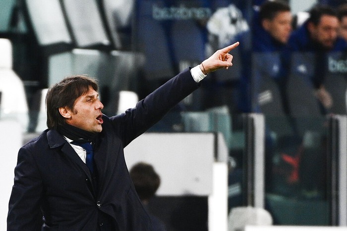 Inter coach Antonio Conte directs his team during the Italian Cup, return-leg, semifinal soccer match between Juventus and Inter Milan, at the Turin Allianz Stadium, Italy, Tuesday, Feb. 9, 2021. (Marco Alpozzi/LaPresse via AP)