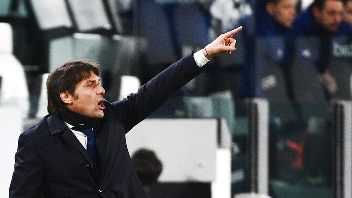 Inter coach Antonio Conte directs his team during the Italian Cup, return-leg, semifinal soccer match between Juventus and Inter Milan, at the Turin Allianz Stadium, Italy, Tuesday, Feb. 9, 2021. (Marco Alpozzi/LaPresse via AP)
