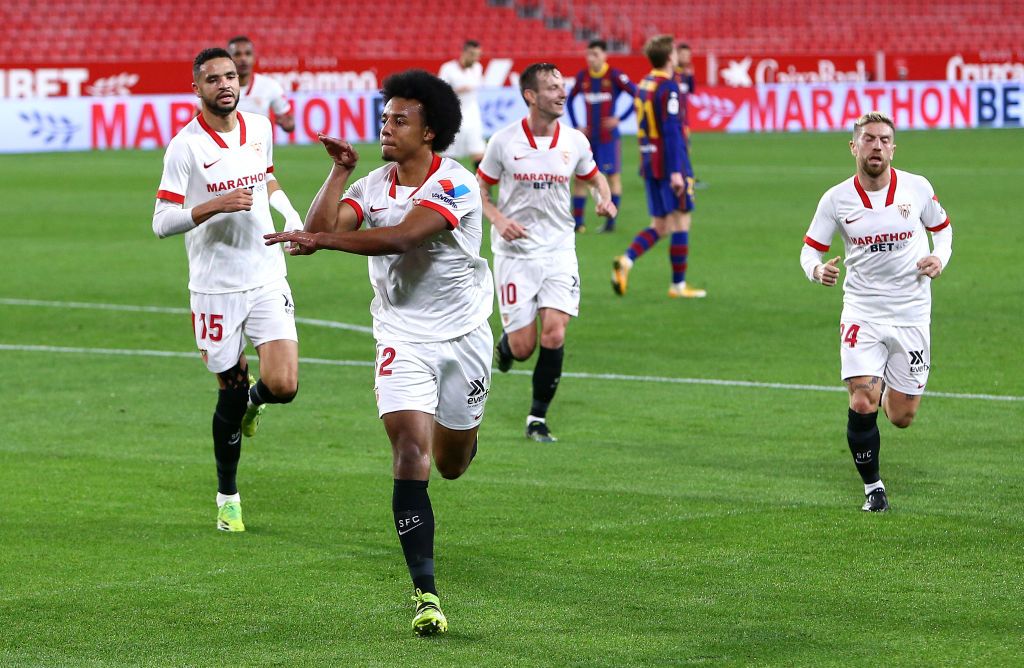 SEVILLE, SPAIN - FEBRUARY 10: Jules Kounde of Sevilla celebrates after scoring their side's first goal during the Copa del Rey Semi Final First Leg match between Sevilla and FC Barcelona at Estadio Ramon Sanchez Pizjuan on February 10, 2021 in Seville, Spain. Sporting stadiums around Spain remain under strict restrictions due to the Coronavirus Pandemic as Government social distancing laws prohibit fans inside venues resulting in games being played behind closed doors. (Photo by Fran Santiago/Getty Images)
