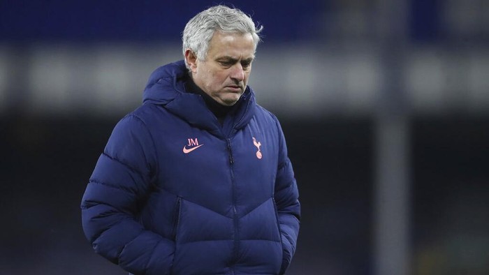 Tottenhams manager Jose Mourinho leaves the bitch in dejection end of the English FA Cup 5th round soccer match between Everton and Tottenham Hotspur at Goodison Park, Liverpool, England, Wednesday, Feb. 10, 2021. Everton won 5-4. (Martin Rickett/Pool via AP)