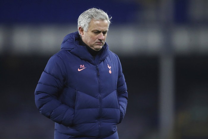 Tottenhams manager Jose Mourinho leaves the bitch in dejection end of the English FA Cup 5th round soccer match between Everton and Tottenham Hotspur at Goodison Park, Liverpool, England, Wednesday, Feb. 10, 2021. Everton won 5-4. (Martin Rickett/Pool via AP)