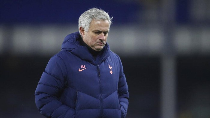 Tottenhams manager Jose Mourinho leaves the bitch in dejection end of the English FA Cup 5th round soccer match between Everton and Tottenham Hotspur at Goodison Park, Liverpool, England, Wednesday, Feb. 10, 2021. Everton won 5-4. (Martin Rickett/Pool via AP)