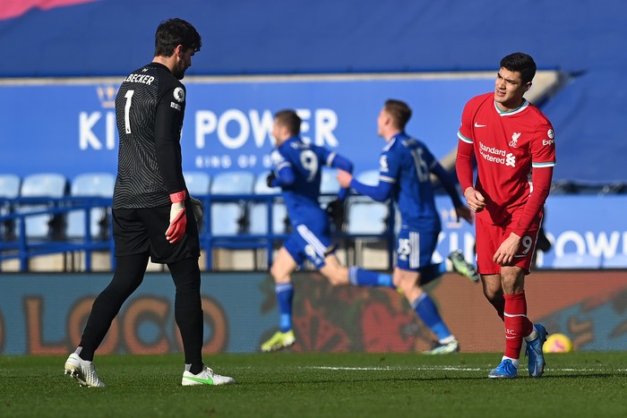 LEICESTER, ENGLAND - FEBRUARY 13: Alisson of Liverpool speaks with Ozan Kabak of Liverpool after they concede a second goal during the Premier League match between Leicester City and Liverpool at The King Power Stadium on February 13, 2021 in Leicester, England. Sporting stadiums around the UK remain under strict restrictions due to the Coronavirus Pandemic as Government social distancing laws prohibit fans inside venues resulting in games being played behind closed doors. (Photo by Michael Regan/Getty Images)
