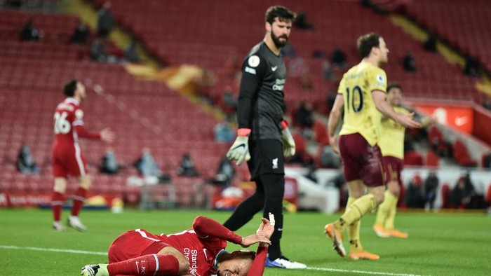 LIVERPOOL, ENGLAND - JANUARY 21: Fabinho of Liverpool reacts during the Premier League match between Liverpool and Burnley at Anfield on January 21, 2021 in Liverpool, England. Sporting stadiums around the UK remain under strict restrictions due to the Coronavirus Pandemic as Government social distancing laws prohibit fans inside venues resulting in games being played behind closed doors. (Photo by Peter Powell - Pool/Getty Images)