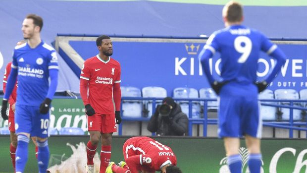 Liverpool's Mohamed Salah, second right, celebrates after scoring his side's opening goal during the English Premier League soccer match between Leicester City and Liverpool at the King Power Stadium in Leicester, England, Saturday, Feb. 13, 2021. (Paul Ellis/Pool Photo via AP)