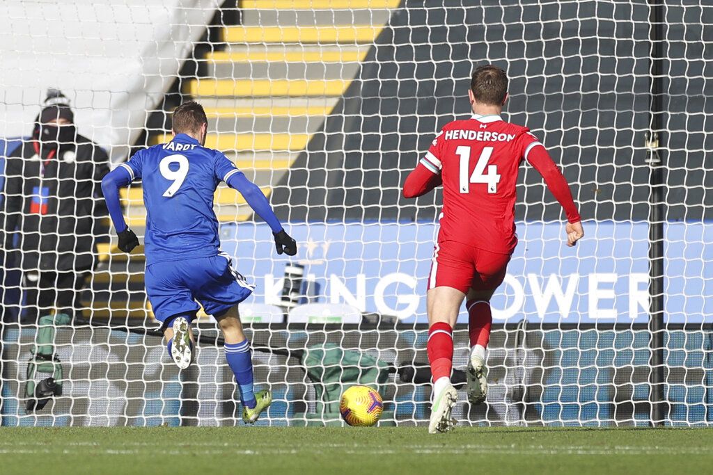 Leicester's Jamie Vardy, left, scores his side's second goal during the English Premier League soccer match between Leicester City and Liverpool at the King Power Stadium in Leicester, England, Saturday, Feb. 13, 2021. (Carl Recine/Pool Photo via AP)