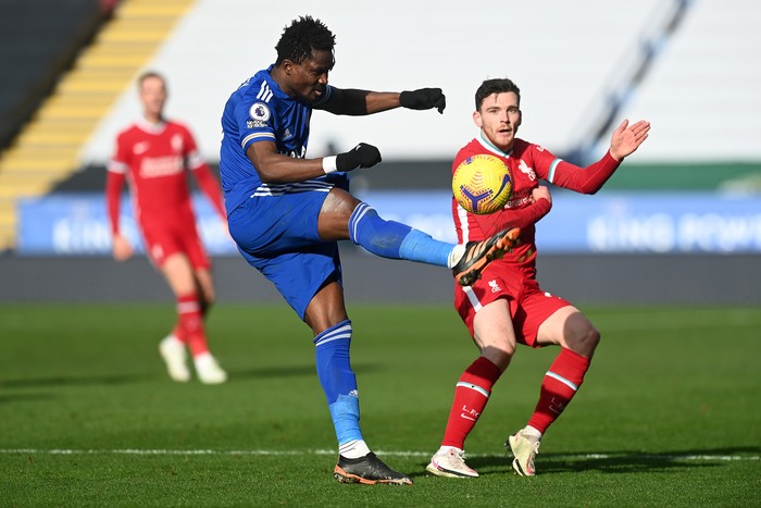 LEICESTER, ENGLAND - FEBRUARY 13: Daniel Amartey of Leicester City controls the ball under pressure from Andrew Robertson of Liverpool during the Premier League match between Leicester City and Liverpool at The King Power Stadium on February 13, 2021 in Leicester, England. Sporting stadiums around the UK remain under strict restrictions due to the Coronavirus Pandemic as Government social distancing laws prohibit fans inside venues resulting in games being played behind closed doors. (Photo by Michael Regan/Getty Images)