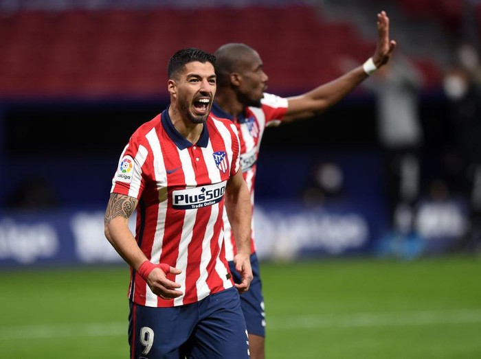 MADRID, SPAIN - FEBRUARY 08: Luis Suarez of Atletico de Madrid celebrates after scoring their teams second goal during the La Liga Santander match between Atletico de Madrid and RC Celta at Estadio Wanda Metropolitano on February 08, 2021 in Madrid, Spain. Sporting stadiums around Spain remain under strict restrictions due to the Coronavirus Pandemic as Government social distancing laws prohibit fans inside venues resulting in games being played behind closed doors.  (Photo by Denis Doyle/Getty Images)
