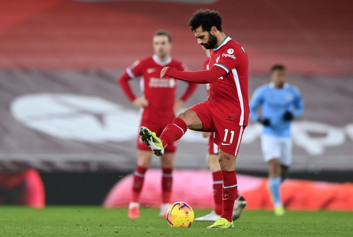 Mohamed Salah LIVERPOOL, ENGLAND - FEBRUARY 07: Mohamed Salah of Liverpool looks dejected after Manchester City's third goal scored by Raheem Sterling (Not pictured) during the Premier League match between Liverpool and Manchester City at Anfield on February 07, 2021 in Liverpool, England. Sporting stadiums around the UK remain under strict restrictions due to the Coronavirus Pandemic as Government social distancing laws prohibit fans inside venues resulting in games being played behind closed doors. (Photo by Laurence Griffiths/Getty Images)