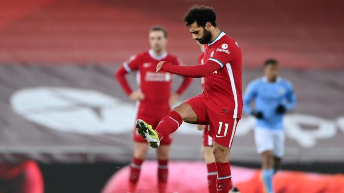 LIVERPOOL, ENGLAND - FEBRUARY 07: Mohamed Salah of Liverpool looks dejected after Manchester Citys third goal scored by Raheem Sterling (Not pictured) during the Premier League match between Liverpool and Manchester City at Anfield on February 07, 2021 in Liverpool, England. Sporting stadiums around the UK remain under strict restrictions due to the Coronavirus Pandemic as Government social distancing laws prohibit fans inside venues resulting in games being played behind closed doors. (Photo by Laurence Griffiths/Getty Images)