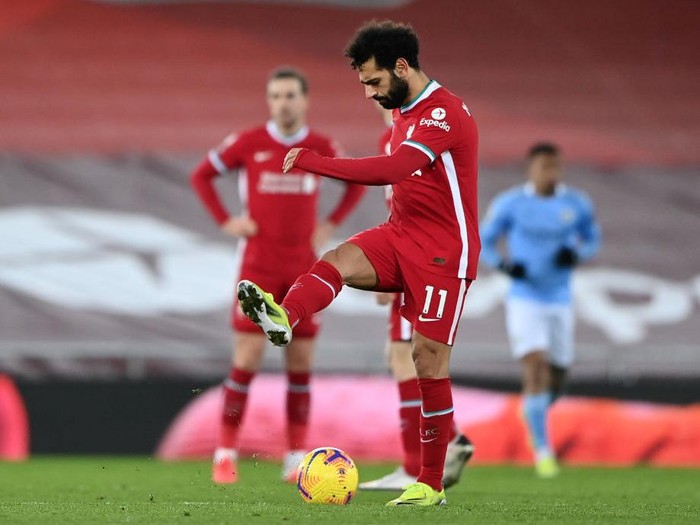 LIVERPOOL, ENGLAND - FEBRUARY 07: Mohamed Salah of Liverpool looks dejected after Manchester City's third goal scored by Raheem Sterling (Not pictured) during the Premier League match between Liverpool and Manchester City at Anfield on February 07, 2021 in Liverpool, England. Sporting stadiums around the UK remain under strict restrictions due to the Coronavirus Pandemic as Government social distancing laws prohibit fans inside venues resulting in games being played behind closed doors. (Photo by Laurence Griffiths/Getty Images)