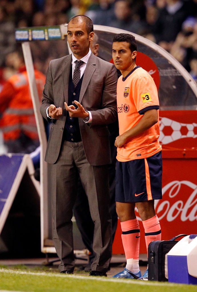 A CORUNA, SPAIN - DECEMBER 5: Coach Pep Guardiola of Barcelona gives instructions to Pedro Rodriguez during the La Liga match between Deportivo La Coruna and Barcelona at the Riazor stadium on December 5, 2009 in A Coruna, Spain. (Photo by Angel Martinez/Getty Images)
