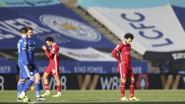 Liverpool's Mohamed Salah, right, reacts after Leicester's James Maddison scores his side's opening goal during the English Premier League soccer match between Leicester City and Liverpool at the King Power Stadium in Leicester, England, Saturday, Feb. 13, 2021. (Carl Recine/Pool Photo via AP)