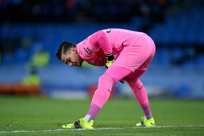 MANCHESTER, ENGLAND - FEBRUARY 13: Ederson of Manchester City stretches prior to the Premier League match between Manchester City and Tottenham Hotspur at Etihad Stadium on February 13, 2021 in Manchester, England. Sporting stadiums around the UK remain under strict restrictions due to the Coronavirus Pandemic as Government social distancing laws prohibit fans inside venues resulting in games being played behind closed doors. (Photo by Shaun Botterill/Getty Images)