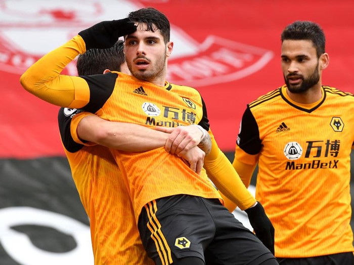 SOUTHAMPTON, ENGLAND - FEBRUARY 14: Pedro Neto of Wolverhampton Wanderers celebrates after scoring their team's second goal with teammate Ruben Neves during the Premier League match between Southampton and Wolverhampton Wanderers at St Mary's Stadium on February 14, 2021 in Southampton, England. Sporting stadiums around the UK remain under strict restrictions due to the Coronavirus Pandemic as Government social distancing laws prohibit fans inside venues resulting in games being played behind closed doors. (Photo by Andy Rain - Pool/Getty Images)