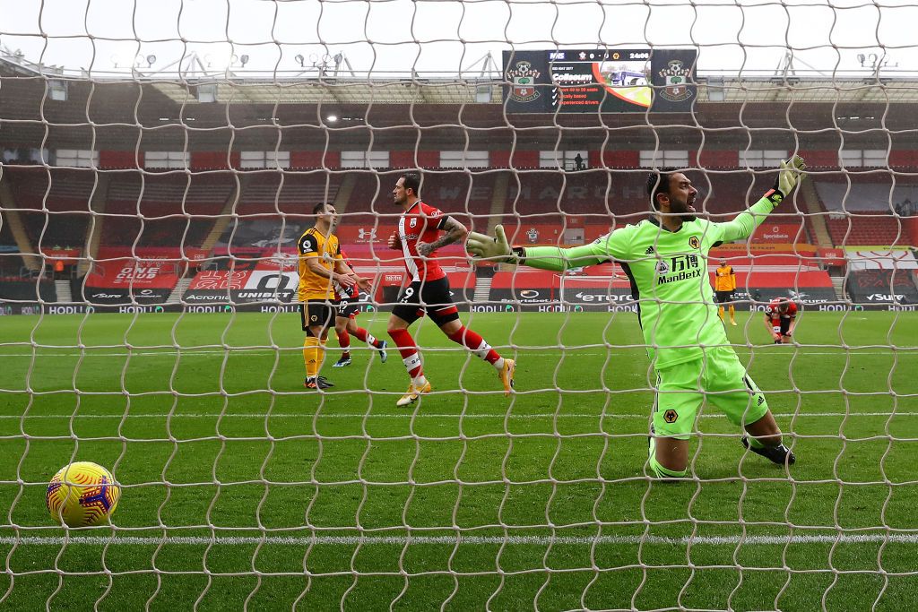 SOUTHAMPTON, ENGLAND - FEBRUARY 14: Pedro Neto of Wolverhampton Wanderers celebrates after scoring their team's second goal with teammate Ruben Neves during the Premier League match between Southampton and Wolverhampton Wanderers at St Mary's Stadium on February 14, 2021 in Southampton, England. Sporting stadiums around the UK remain under strict restrictions due to the Coronavirus Pandemic as Government social distancing laws prohibit fans inside venues resulting in games being played behind closed doors. (Photo by Andy Rain - Pool/Getty Images)