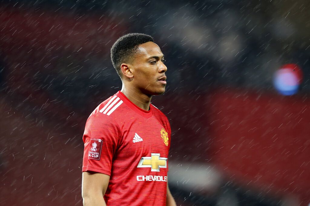 Manchester United's Anthony Martial walks on the pitch during the English FA Cup 5th round soccer match between Manchester United and West Ham United at Old Trafford in Manchester, England, Tuesday, Feb. 9, 2021. (Martin Rickett/Pool via AP)