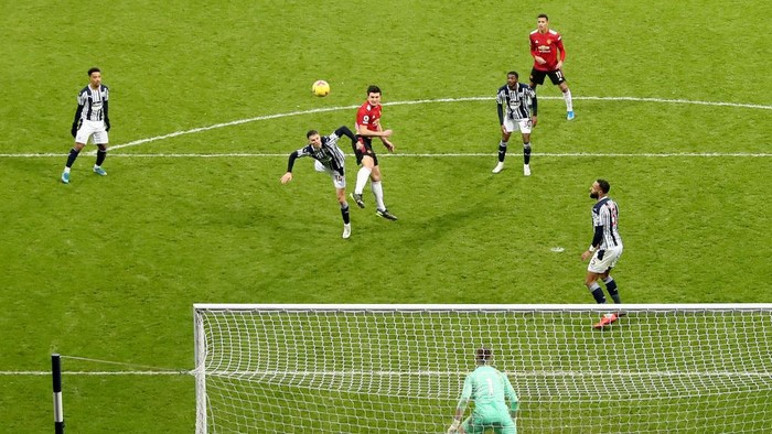 WEST BROMWICH, ENGLAND - FEBRUARY 14: Harry Maguire of Manchester United heads the ball which hits the post during the Premier League match between West Bromwich Albion and Manchester United at The Hawthorns on February 14, 2021 in West Bromwich, England. Sporting stadiums around the UK remain under strict restrictions due to the Coronavirus Pandemic as Government social distancing laws prohibit fans inside venues resulting in games being played behind closed doors. (Photo by Naomi Baker/Getty Images)