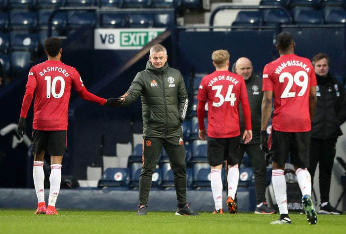 WEST BROMWICH, ENGLAND - FEBRUARY 14: Ole Gunnar Solskjaer, Manager of Manchester United interacts with Marcus Rashford of Manchester United after the Premier League match between West Bromwich Albion and Manchester United at The Hawthorns on February 14, 2021 in West Bromwich, England. Sporting stadiums around the UK remain under strict restrictions due to the Coronavirus Pandemic as Government social distancing laws prohibit fans inside venues resulting in games being played behind closed doors. (Photo by Nick Potts - Pool/Getty Images)