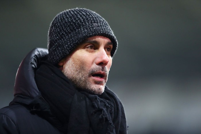 SWANSEA, WALES - FEBRUARY 10: Pep Guardiola, Manager of Manchester City reacts during The Emirates FA Cup Fifth Round match between Swansea City and Manchester City at Liberty Stadium on February 10, 2021 in Swansea, Wales. Sporting stadiums around the UK remain under strict restrictions due to the Coronavirus Pandemic as Government social distancing laws prohibit fans inside venues resulting in games being played behind closed doors. (Photo by Michael Steele/Getty Images)