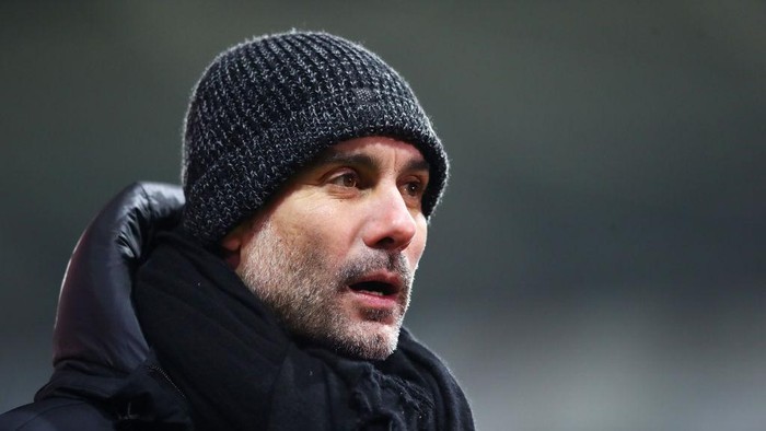 SWANSEA, WALES - FEBRUARY 10: Pep Guardiola, Manager of Manchester City reacts during The Emirates FA Cup Fifth Round match between Swansea City and Manchester City at Liberty Stadium on February 10, 2021 in Swansea, Wales. Sporting stadiums around the UK remain under strict restrictions due to the Coronavirus Pandemic as Government social distancing laws prohibit fans inside venues resulting in games being played behind closed doors. (Photo by Michael Steele/Getty Images)