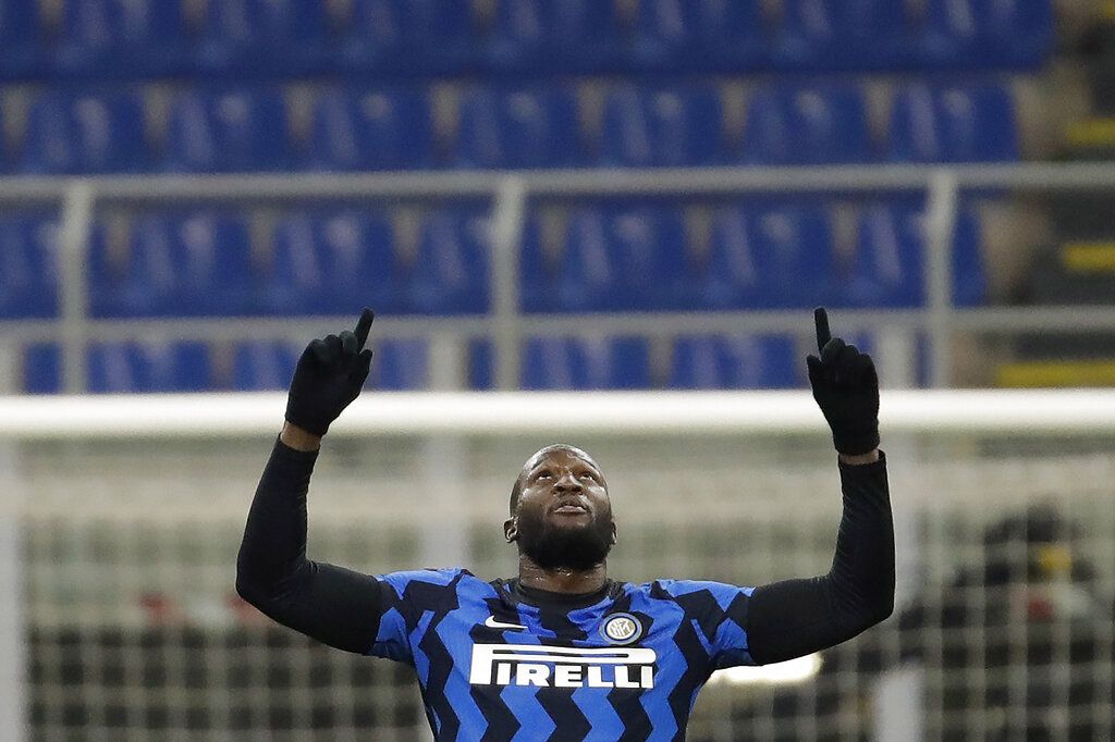 Inter Milan's Romelu Lukaku celebrates after scores his second goal against Lazio during a Serie A soccer match between Inter Milan and Lazio at the San Siro stadium in Milan, Italy, Sunday, Feb. 14, 2021. (AP Photo/Luca Bruno)