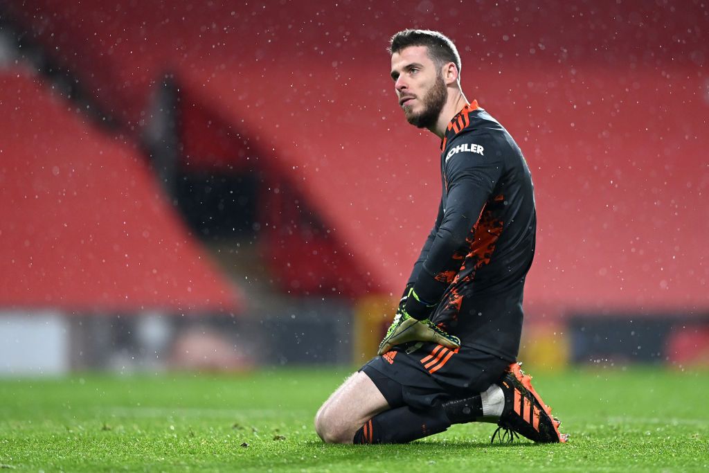 MANCHESTER, ENGLAND - JANUARY 27: David De Gea of Manchester United reacts after Sheffield United score their second goal during the Premier League match between Manchester United and Sheffield United at Old Trafford on January 27, 2021 in Manchester, England. Sporting stadiums around the UK remain under strict restrictions due to the Coronavirus Pandemic as Government social distancing laws prohibit fans inside venues resulting in games being played behind closed doors. (Photo by Laurence Griffiths/Getty Images)