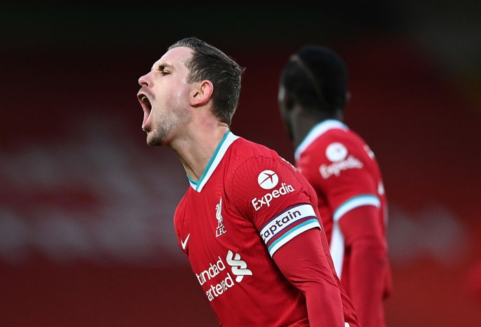 LIVERPOOL, ENGLAND - FEBRUARY 07: Jordan Henderson of Liverpool reacts after a referee decision during the Premier League match between Liverpool and Manchester City at Anfield on February 07, 2021 in Liverpool, England. Sporting stadiums around the UK remain under strict restrictions due to the Coronavirus Pandemic as Government social distancing laws prohibit fans inside venues resulting in games being played behind closed doors. (Photo by Laurence Griffiths/Getty Images)