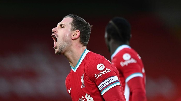 LIVERPOOL, ENGLAND - FEBRUARY 07: Jordan Henderson of Liverpool reacts after a referee decision during the Premier League match between Liverpool and Manchester City at Anfield on February 07, 2021 in Liverpool, England. Sporting stadiums around the UK remain under strict restrictions due to the Coronavirus Pandemic as Government social distancing laws prohibit fans inside venues resulting in games being played behind closed doors. (Photo by Laurence Griffiths/Getty Images)