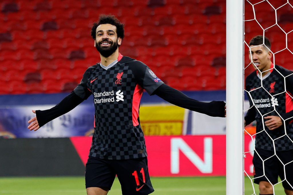 BUDAPEST, HUNGARY - FEBRUARY 16: Mohamed Salah of Liverpool celebrates after scoring their side's first goal during the UEFA Champions League Round of 16 match between RB Leipzig and Liverpool FC at Puskas Arena on February 16, 2021 in Budapest, Hungary. Liverpool face RB Leipzig at a neutral venue in Budapest behind closed doors after Germany imposed a ban on travellers arriving from the UK in an effort to prevent the spread of Covid-19 variants. (Photo by Laszlo Szirtesi/Getty Images)