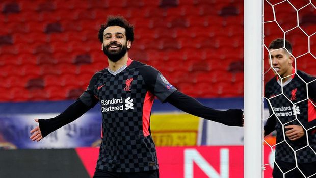 BUDAPEST, HUNGARY - FEBRUARY 16: Mohamed Salah of Liverpool celebrates after scoring their side's first goal during the UEFA Champions League Round of 16 match between RB Leipzig and Liverpool FC at Puskas Arena on February 16, 2021 in Budapest, Hungary. Liverpool face RB Leipzig at a neutral venue in Budapest behind closed doors after Germany imposed a ban on travellers arriving from the UK in an effort to prevent the spread of Covid-19 variants. (Photo by Laszlo Szirtesi/Getty Images)