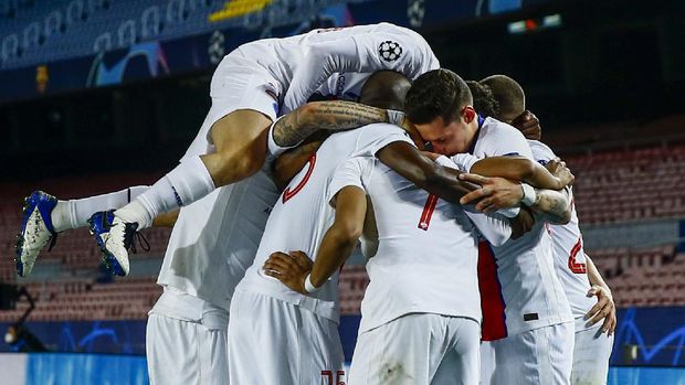 PSG's Kylian Mbappe celebrates after scoring during the Champions League round of 16, first leg soccer match between FC Barcelona and Paris Saint-Germain at the Camp Nou stadium in Barcelona, Spain, Tuesday, Feb. 16, 2021. (AP Photo/Joan Monfort)
