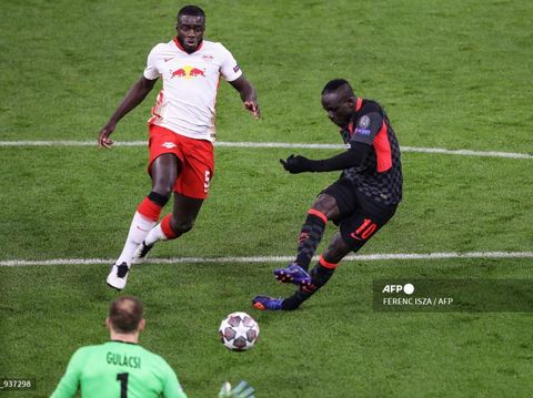 Liverpool's Senegalese striker Sadio Mane scores his team's second goal during the UEFA Champions League round of 16 first leg football match between RB Leipzig and FC Liverpool at the Puskas Arena in Budapest on February 16, 2021. (Photo by FERENC ISZA / AFP)