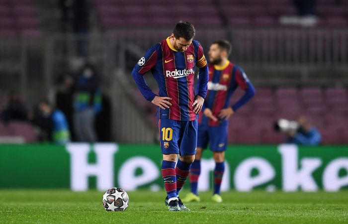 Lionel Messi BARCELONA, SPAIN - FEBRUARY 16: Lionel Messi of FC Barcelona reacts after conceding his side concedes their first goal during the UEFA Champions League Round of 16 match between FC Barcelona and Paris Saint-Germain at Camp Nou on February 16, 2021 in Barcelona, Spain. Sporting stadiums around Spain remain under strict restrictions due to the Coronavirus Pandemic as Government social distancing laws prohibit fans inside venues resulting in games being played behind closed doors. (Photo by David Ramos/Getty Images)