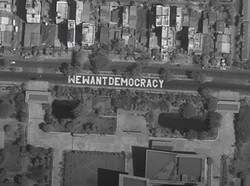 Massa Anti-Kudeta di Myanmar Bikin Mural Kami Ingin Demokrasi