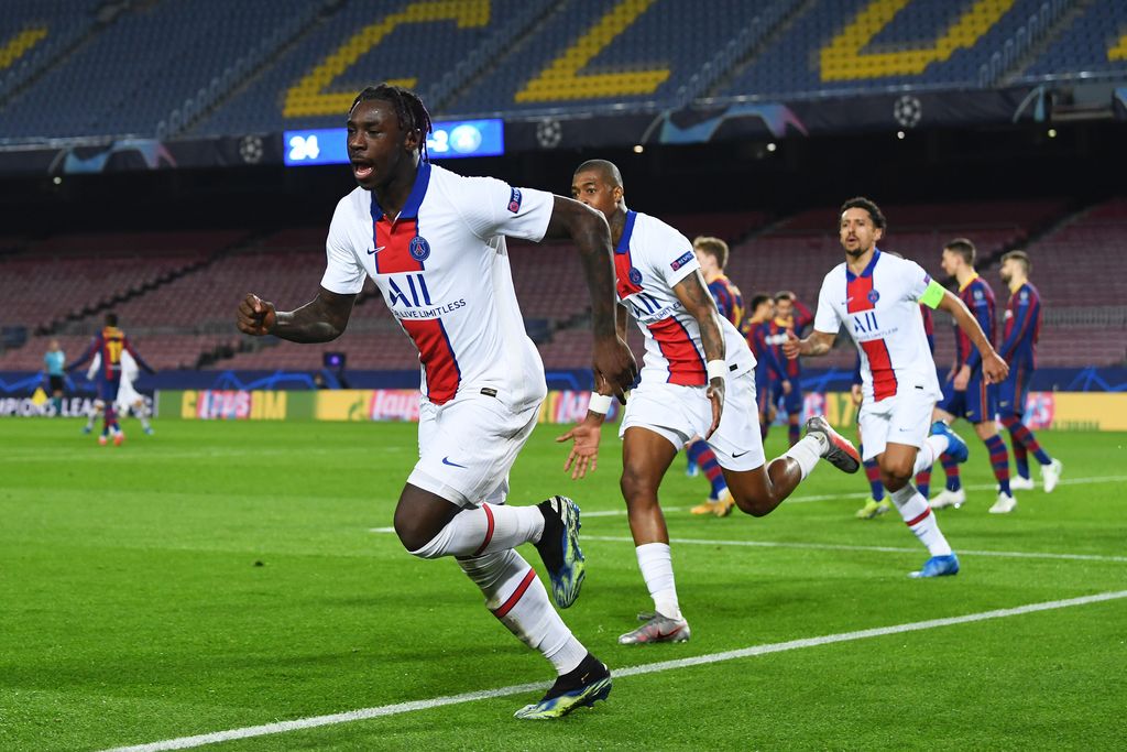 BARCELONA, SPAIN - FEBRUARY 16: Moise Keane of Paris Saint-Germain celebrates after scoring their side's third goal during the UEFA Champions League Round of 16 match between FC Barcelona and Paris Saint-Germain at Camp Nou on February 16, 2021 in Barcelona, Spain. Sporting stadiums around Spain remain under strict restrictions due to the Coronavirus Pandemic as Government social distancing laws prohibit fans inside venues resulting in games being played behind closed doors. (Photo by David Ramos/Getty Images)