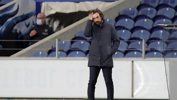Juventus head coach Andrea Pirlo stands by the touchline during the Champions League round of 16, first leg, soccer match between FC Porto and Juventus at the Dragao stadium in Porto, Portugal, Wednesday, Feb. 17, 2021. (AP Photo/Luis Vieira)