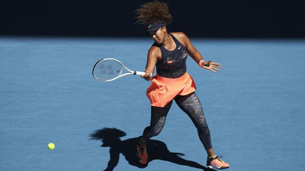 Japan's Naomi Osaka hits a forehand return to United States' Serena Williams during their semifinal match at the Australian Open tennis championship in Melbourne, Australia, Thursday, Feb. 18, 2021.(AP Photo/Hamish Blair)