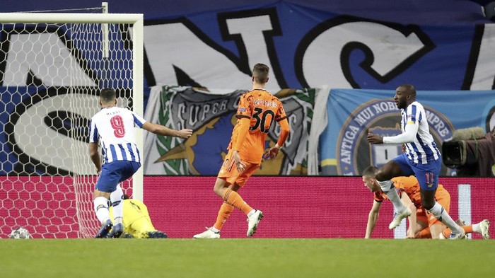 Portos Moussa Marega, right, celebrates after scoring his sides second goal during the Champions League round of 16, first leg, soccer match between FC Porto and Juventus at the Dragao stadium in Porto, Portugal, Wednesday, Feb. 17, 2021. (AP Photo/Luis Vieira)