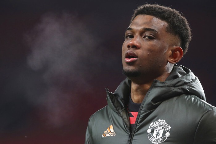 Manchester United's Amad Diallo warms up before the English FA Cup 5th round soccer match between Manchester United and West Ham United at Old Trafford in Manchester, England, Tuesday, Feb. 9, 2021. (Martin Rickett/Pool via AP)