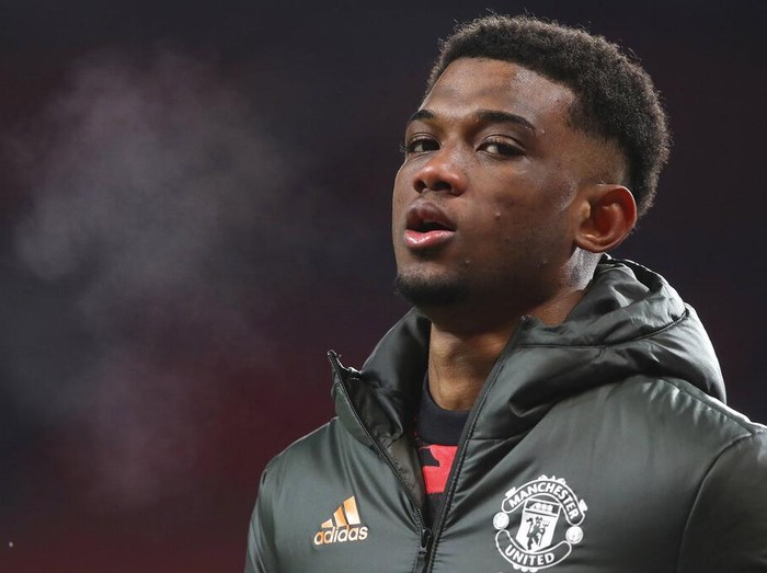 Manchester United's Amad Diallo warms up before the English FA Cup 5th round soccer match between Manchester United and West Ham United at Old Trafford in Manchester, England, Tuesday, Feb. 9, 2021. (Martin Rickett/Pool via AP)